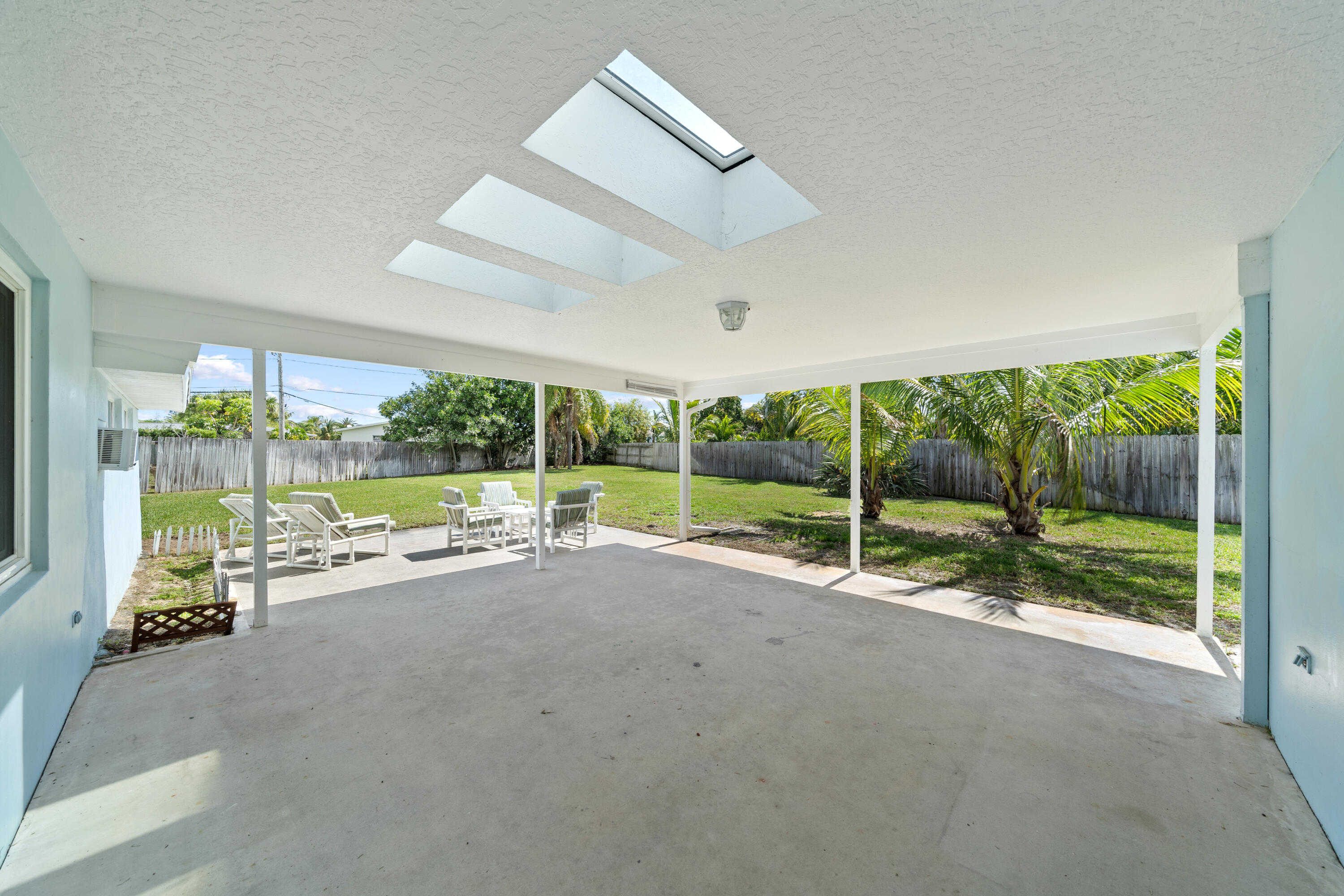 415 Rosedale Drive Satellite Beach, FL 32937 - Photo 32 of 52 a view of a room with wooden floor and windows