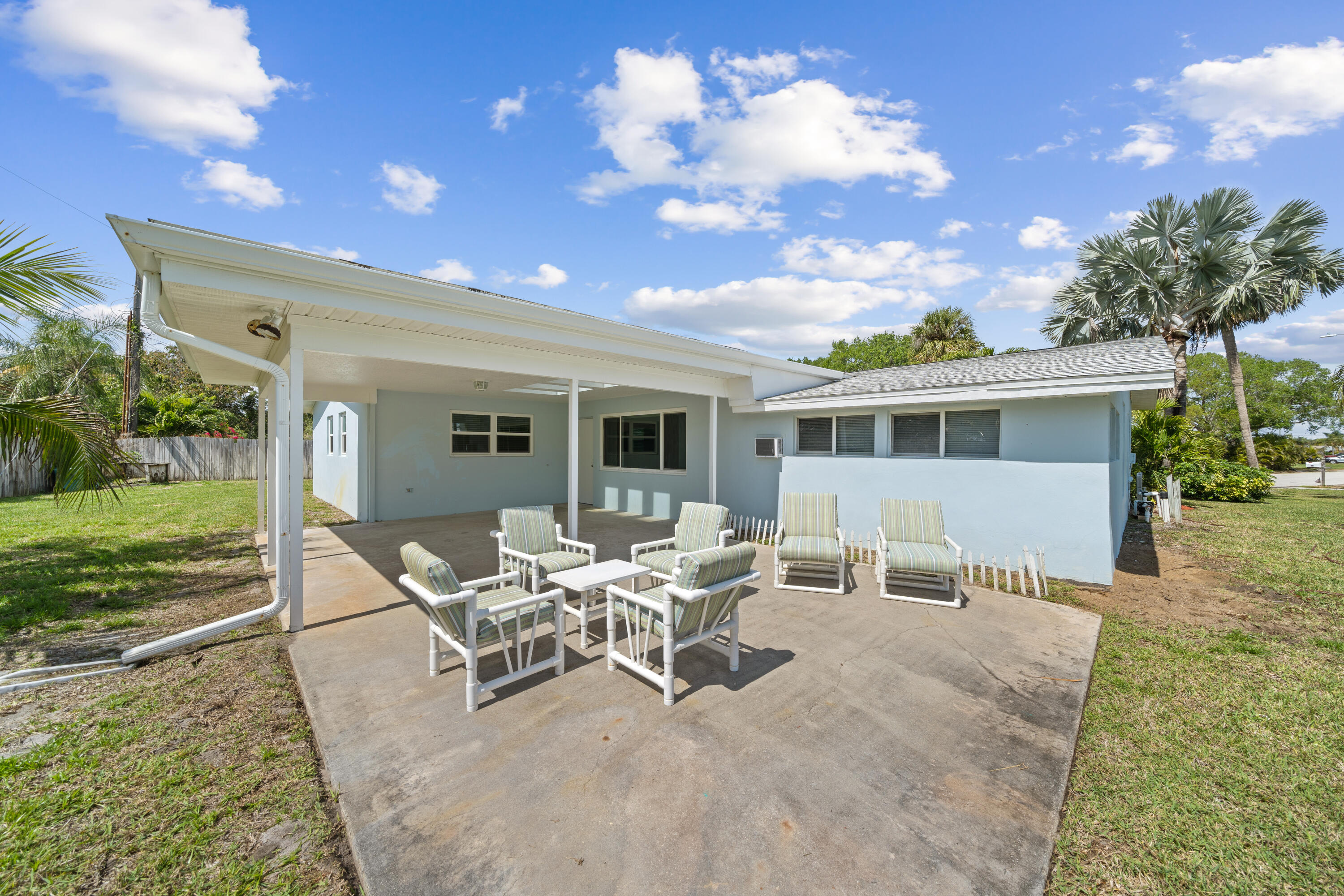 415 Rosedale Drive Satellite Beach, FL 32937 - Photo 33 of 52 a view of a house with backyard sitting area and garden