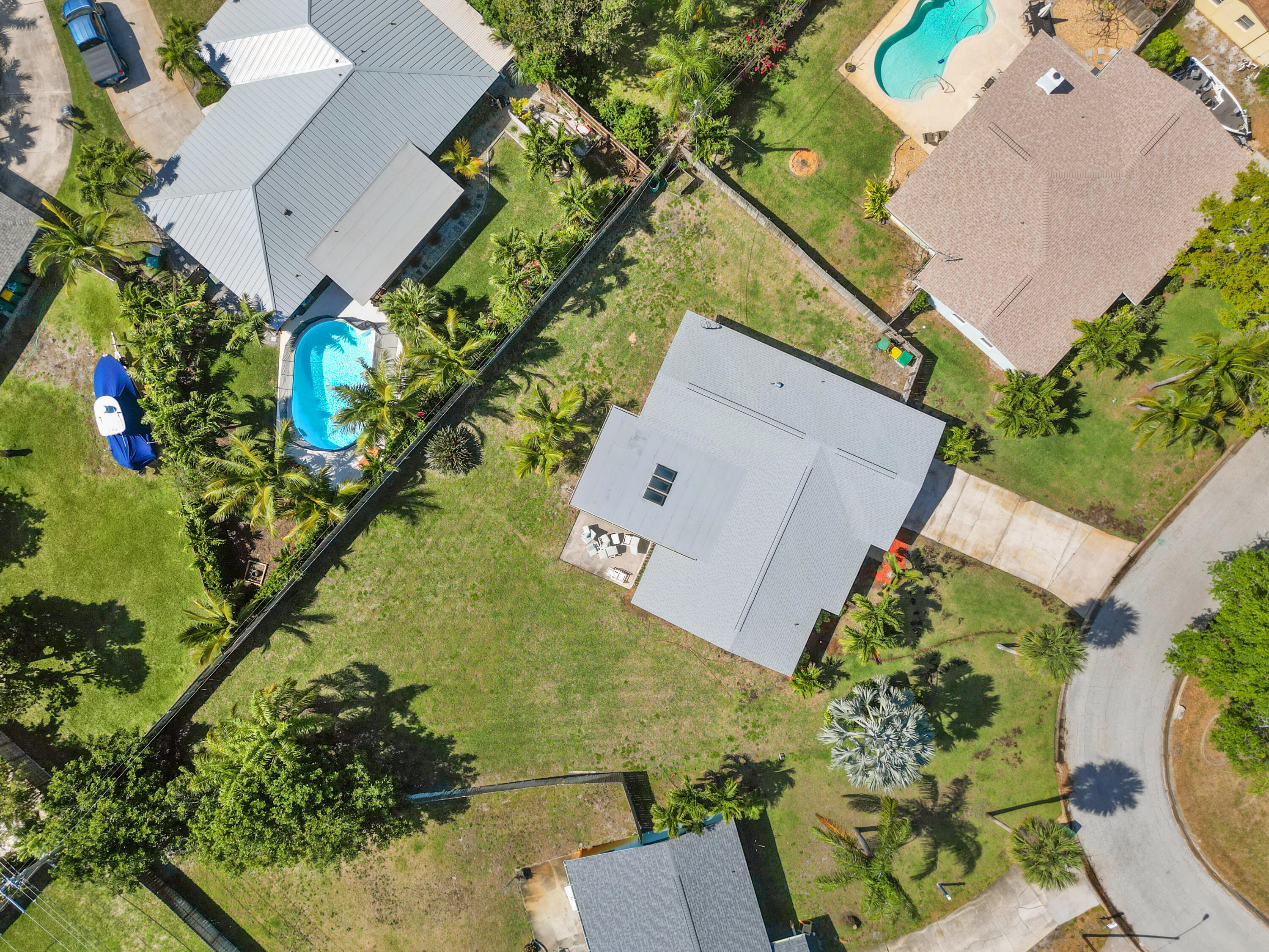 415 Rosedale Drive Satellite Beach, FL 32937 - Photo 36 of 52 an aerial view of a house with a yard and garden