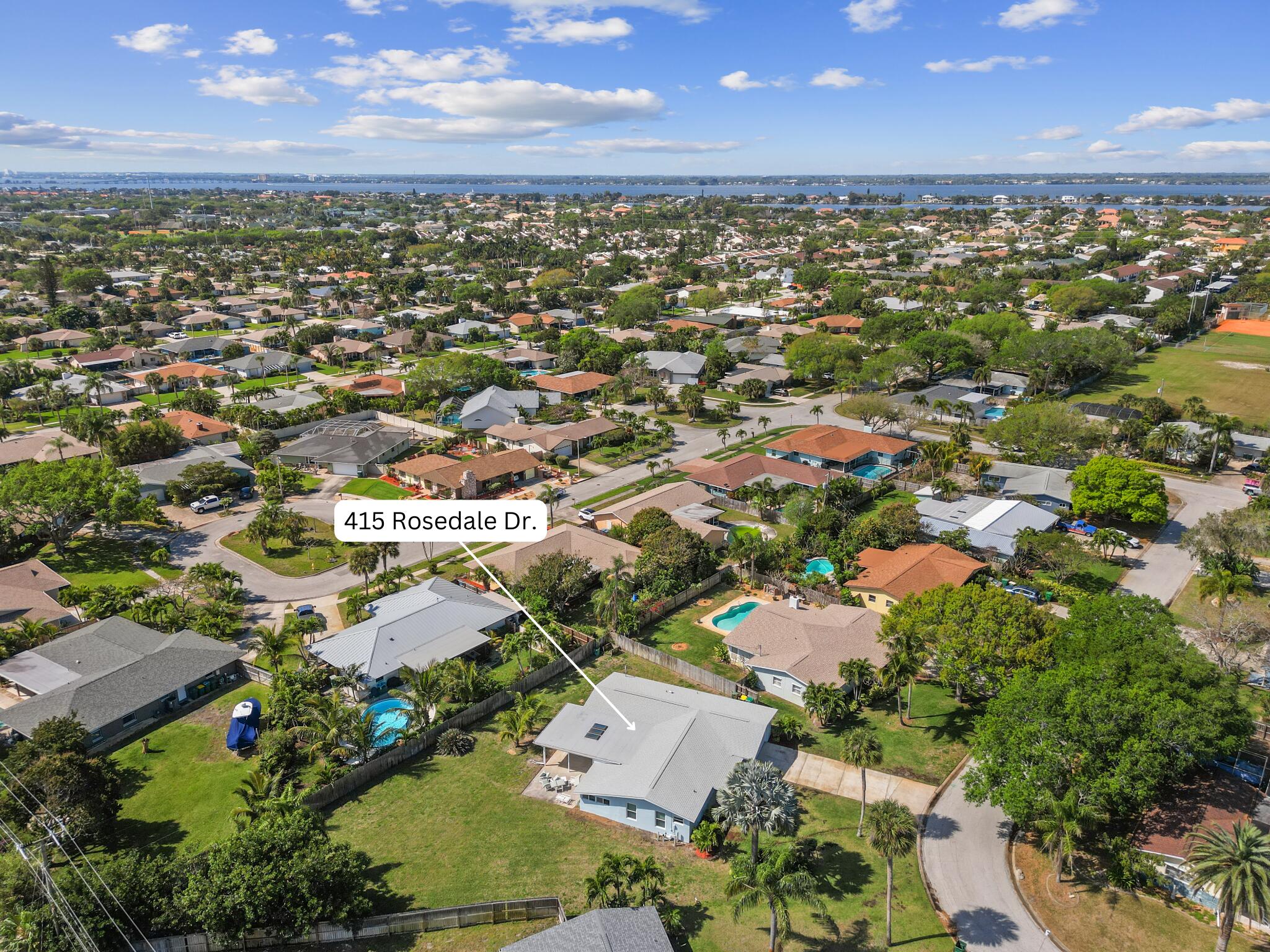 415 Rosedale Drive Satellite Beach, FL 32937 - Photo 37 of 52 an aerial view of residential houses with outdoor space
