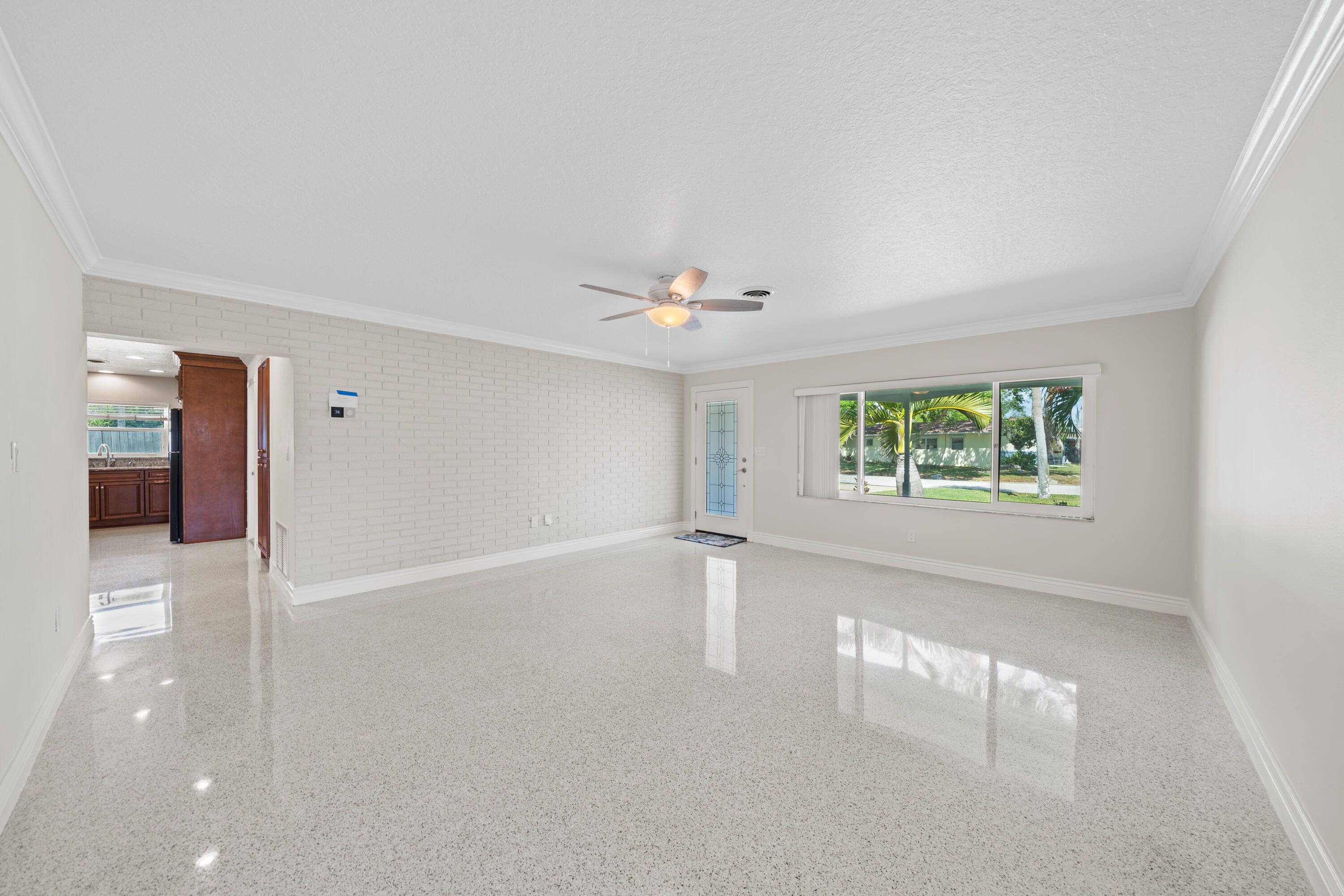 415 Rosedale Drive Satellite Beach, FL 32937 - Photo 9 of 52 an empty room with windows and entrance