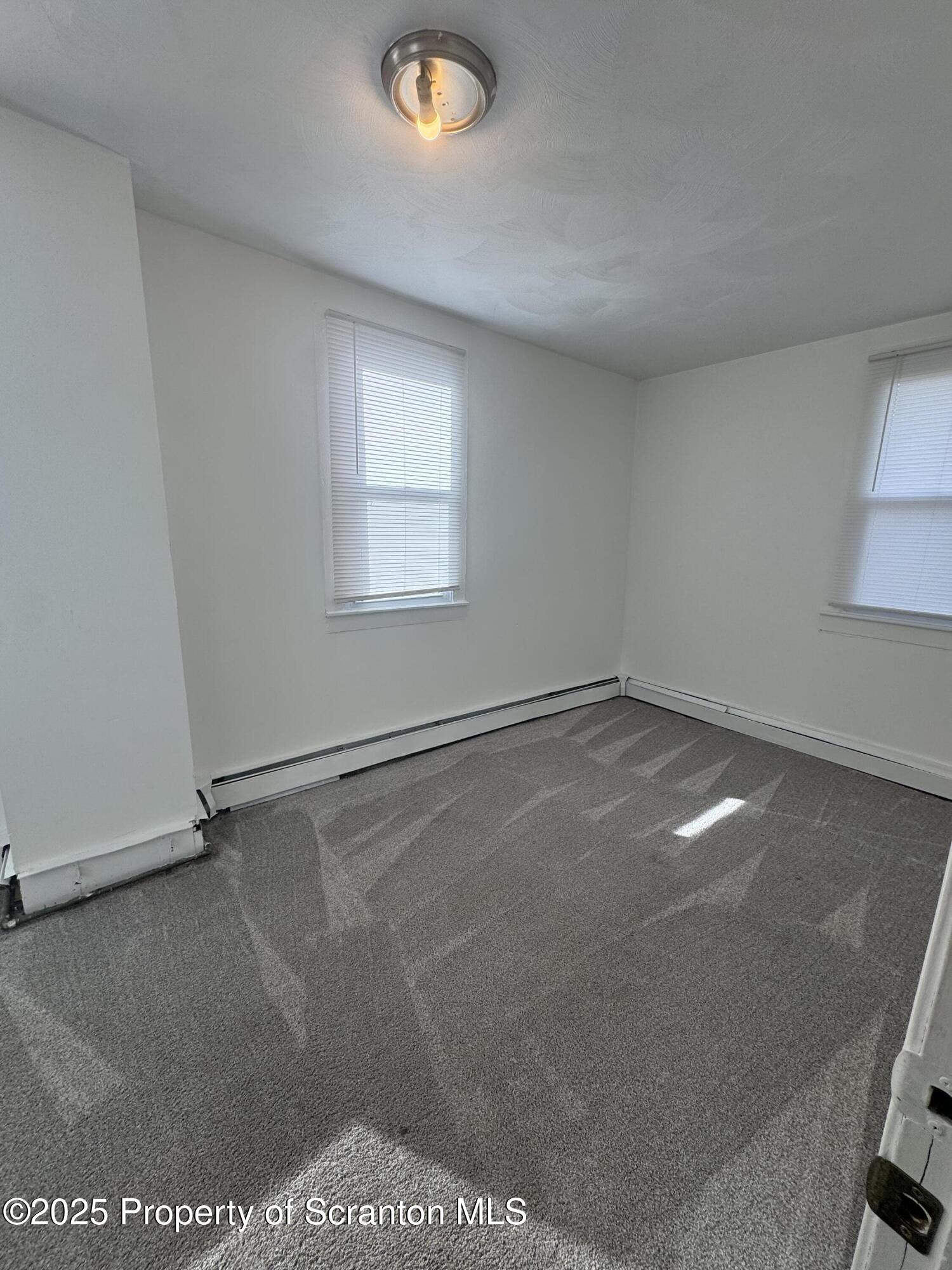 1135 Lloyd Street, Unit 2 Scranton, PA 18508 - Photo 17 of 18 an empty room with a workbench