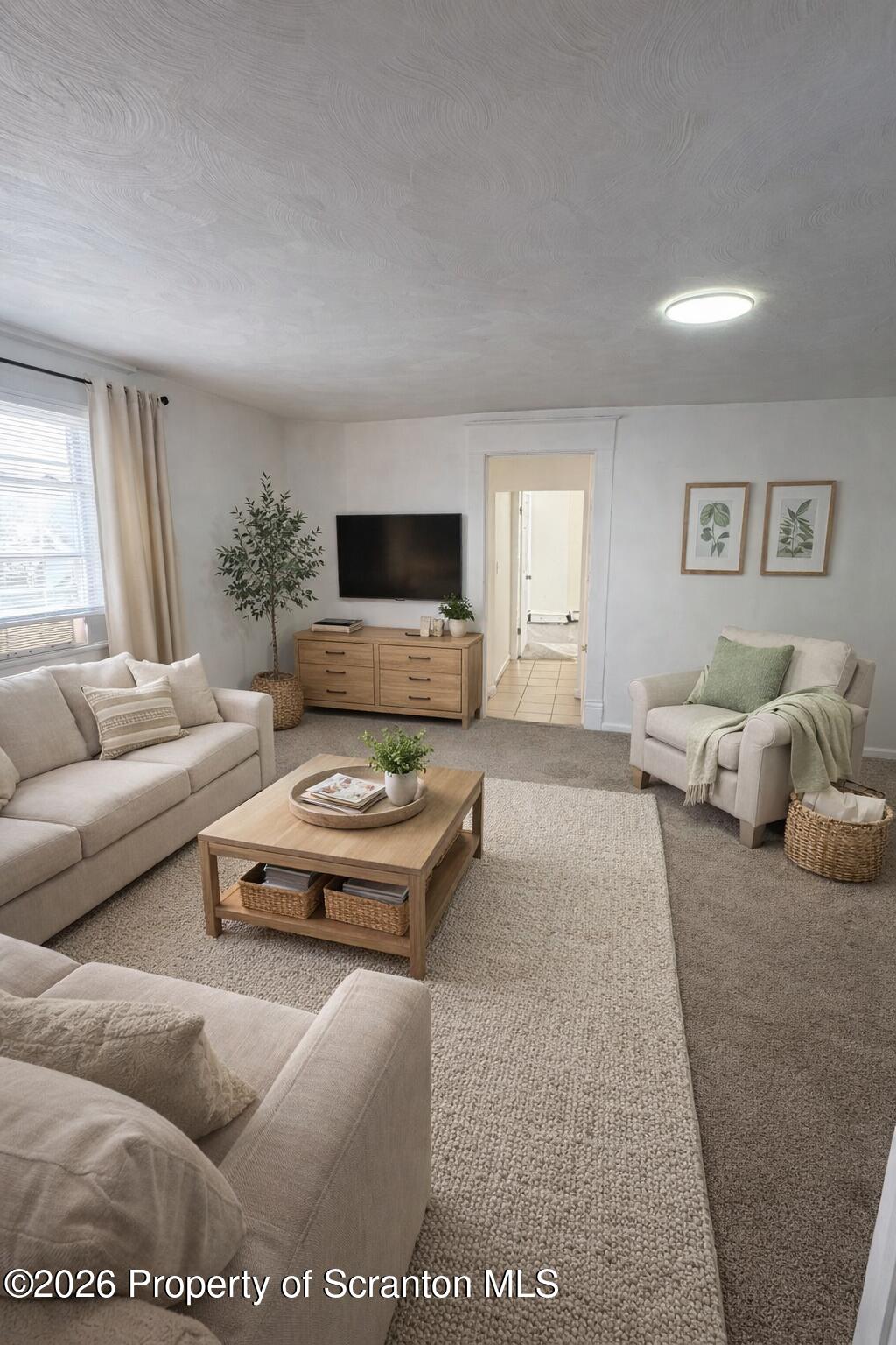 1135 Lloyd Street, Unit 2 Scranton, PA 18508 - Photo 4 of 21 a living room with furniture and a flat screen tv