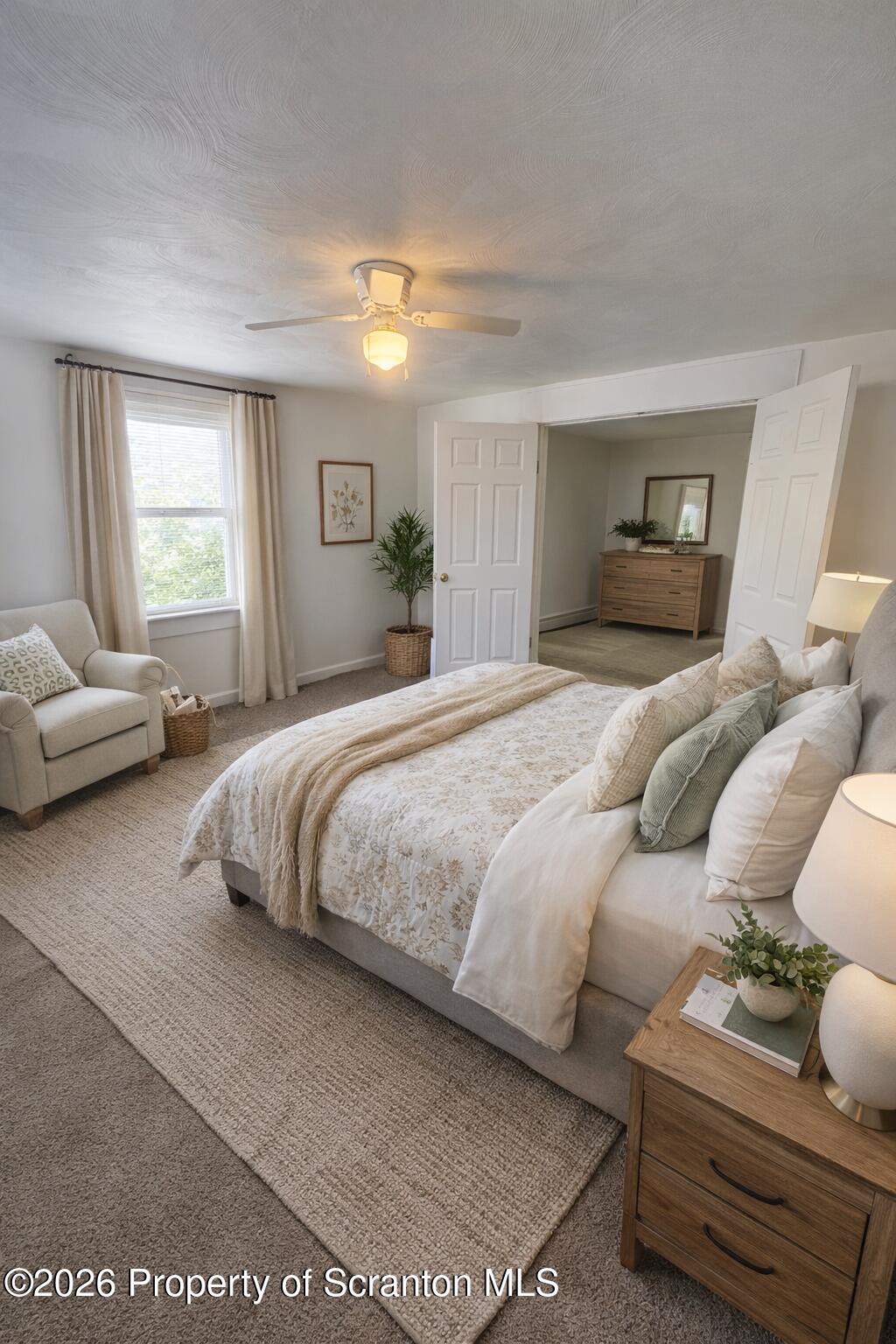 1135 Lloyd Street, Unit 2 Scranton, PA 18508 - Photo 5 of 21 a bedroom with a bed and wooden floor