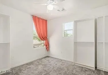 a bathroom with a shower a toilet and sink