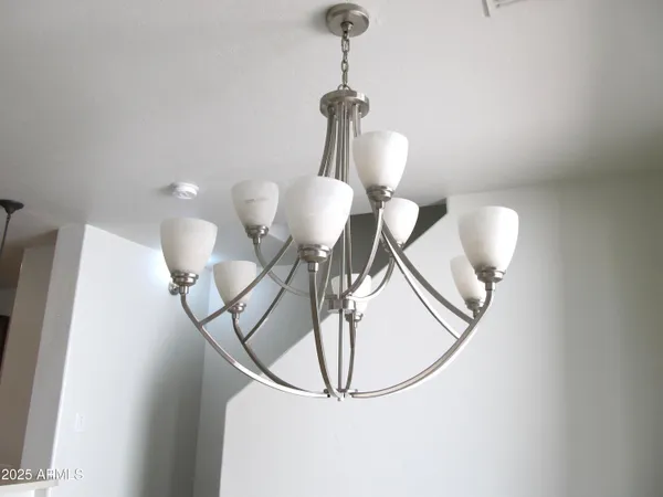 a view of a hallway with a chandelier