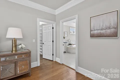 a spacious bathroom with a granite countertop tub double sink and a mirror