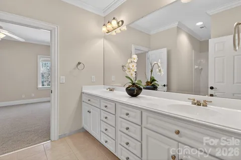 a view of a chandelier fan and entryway