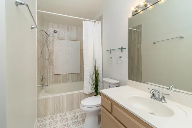 a bathroom with a sink vanity and a mirror