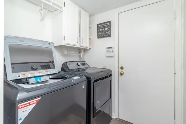 a front view of a house with a garden and outdoor seating
