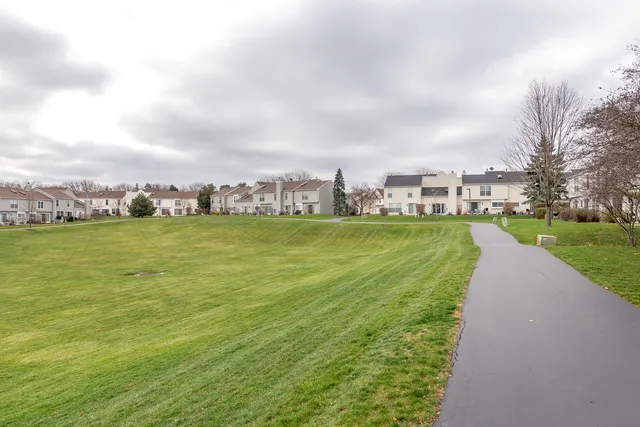 a view of a lake with houses in the back