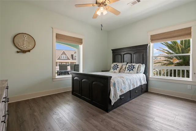 a bedroom with a large bed and a window