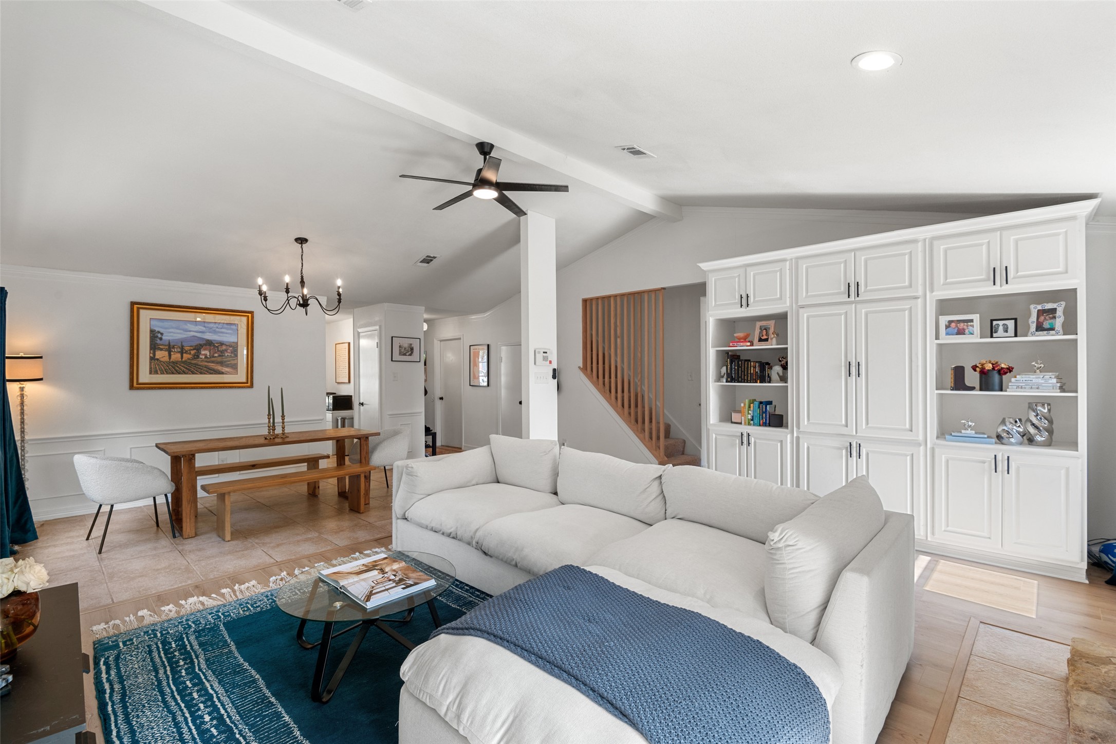 9833 Briar Ridge Drive Austin, TX 78748 - Photo 4 of 29 Living area featuring a chandelier, ceiling fan, and wainscoting