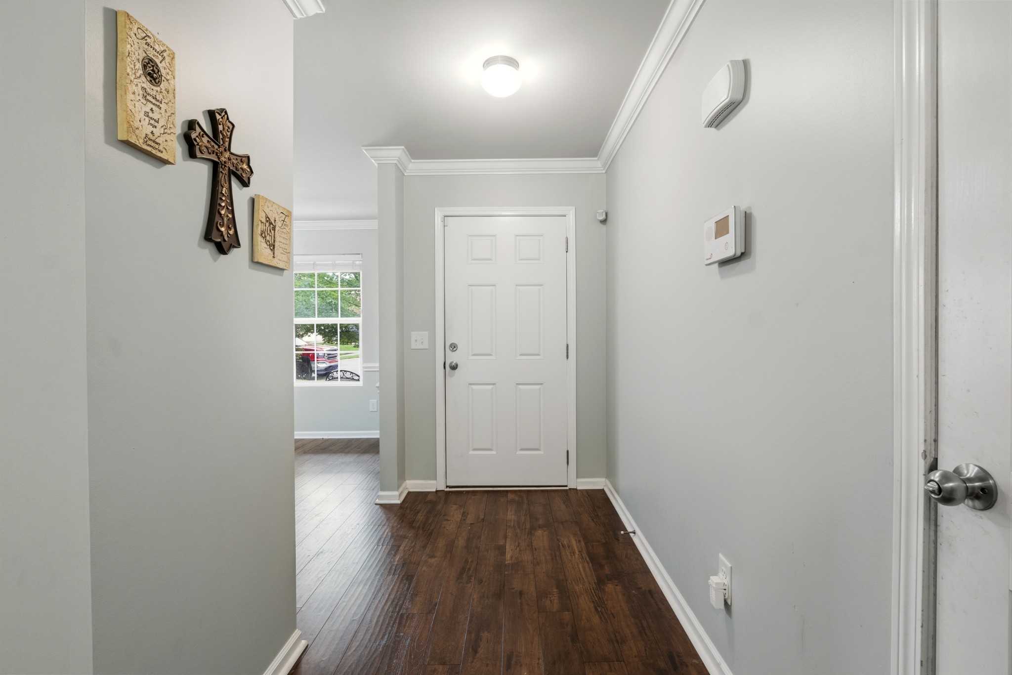 1011 Benwick Road Hendersonville, TN 37075 - Photo 9 of 60 a view of a hallway with wooden floor and closet