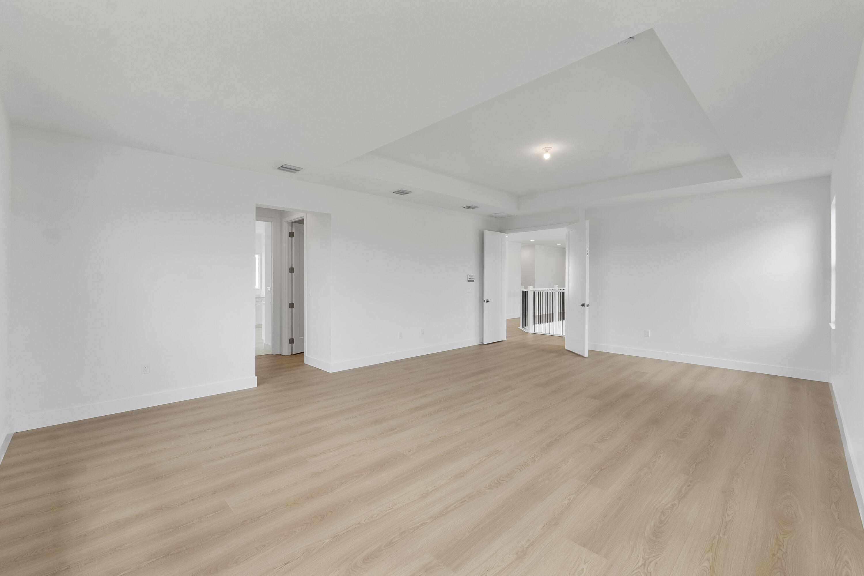 9322 Sunflower Mdw Road Boca Raton, FL 33434 - Photo 31 of 87 a view of an empty room with wooden floor and a window