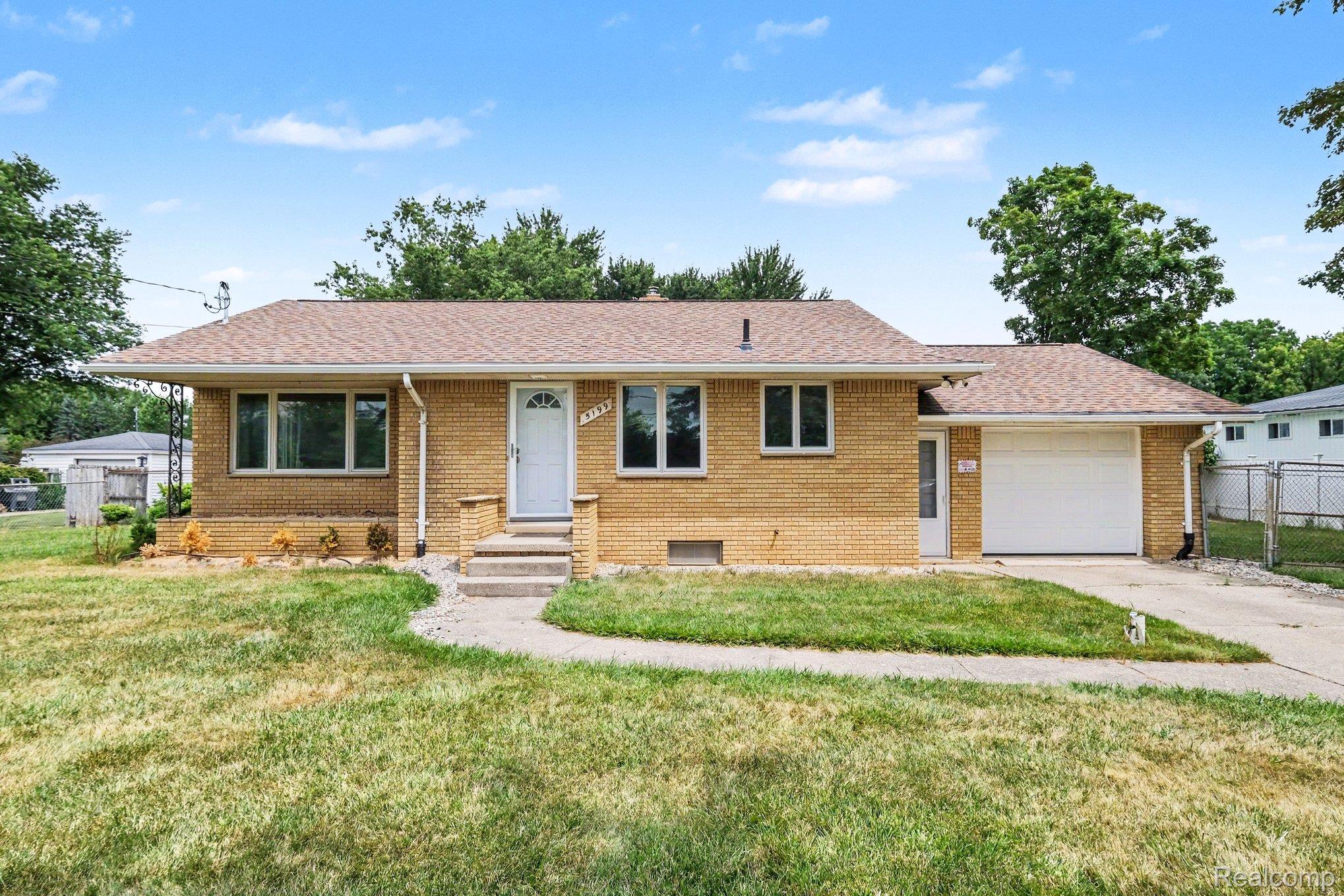 5199 Lapeer Road Burton, MI 48509 - Photo 2 of 19 Ranch-style residence featuring a brick exterior and a brown shingle roof