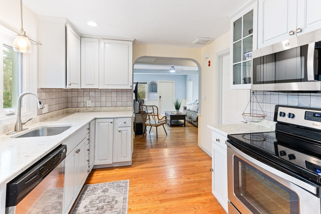 17 Weaver Street Wareham, MA 02576 - Photo 11 of 37 a large kitchen with stainless steel appliances granite countertop a lot of counter space and a sink
