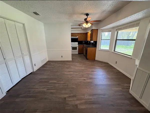 a view of a kitchen with a sink cabinet and a window