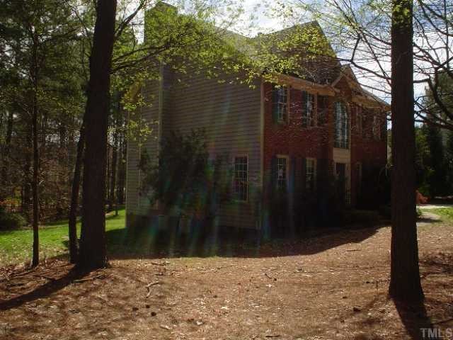 11824 Six Forks Road Raleigh, NC 27614 - Photo 2 of 4 a backyard of a house with lots of green space
