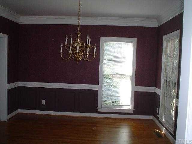 11824 Six Forks Road Raleigh, NC 27614 - Photo 4 of 4 a view of a livingroom with wooden floor and a large window