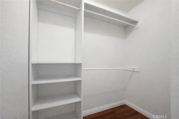 a view of an empty walk in closet