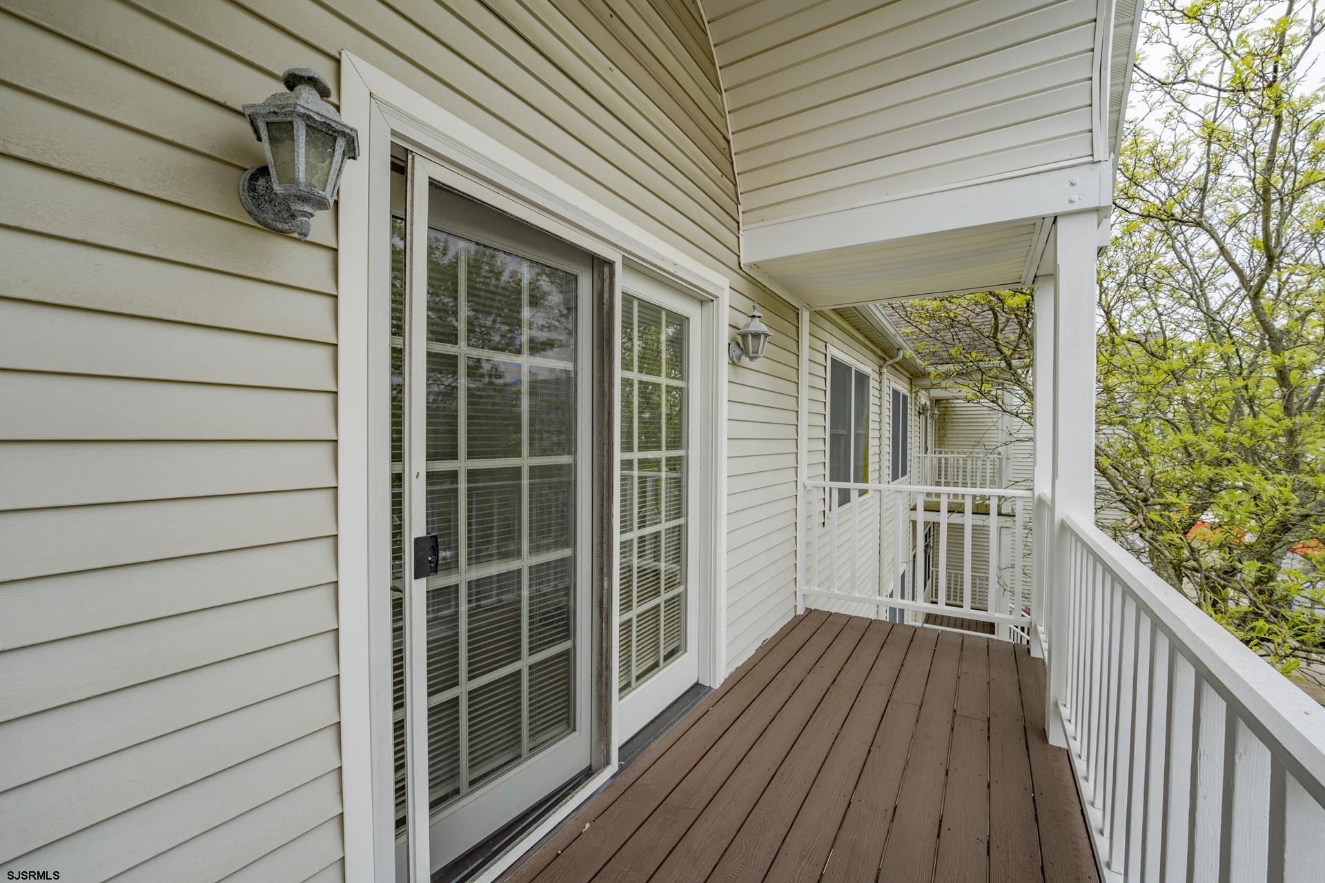 19 Clipper Court Atlantic City, NJ 08401 - Photo 24 of 53 a view of a balcony with wooden floor and fence