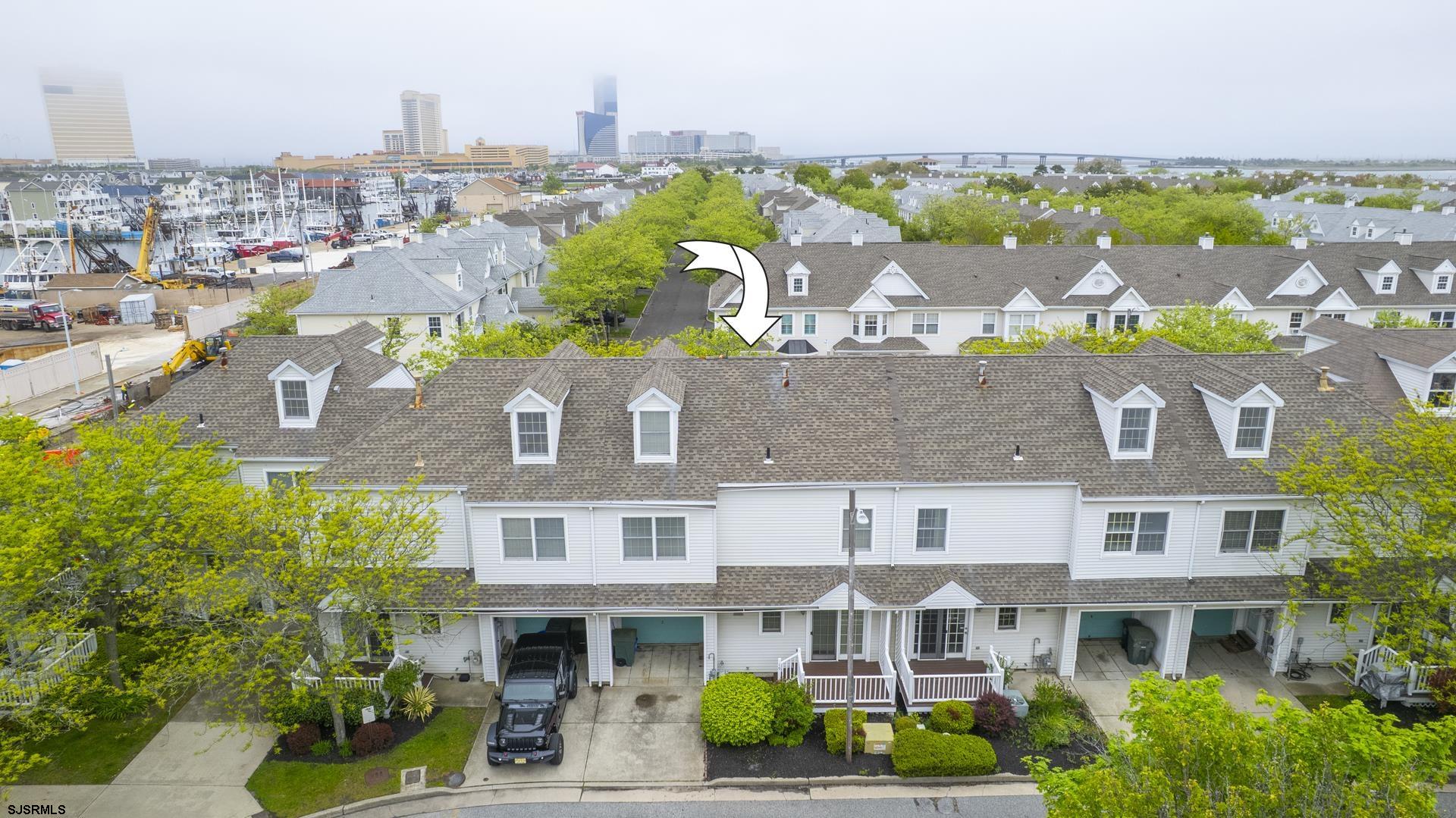 19 Clipper Court Atlantic City, NJ 08401 - Photo 43 of 53 a front view of a residential apartment building with a yard