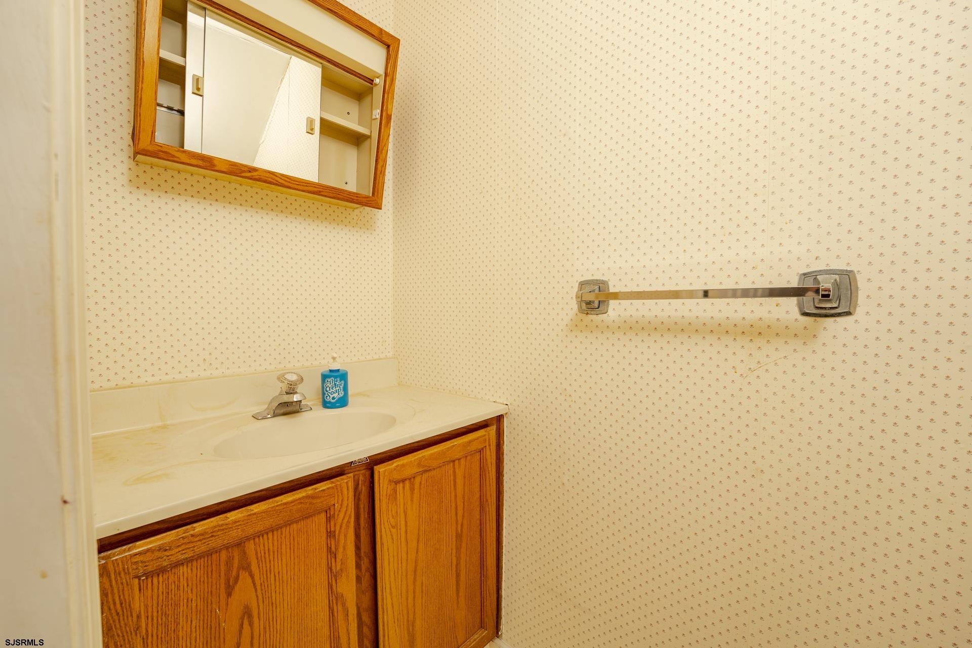 19 Clipper Court Atlantic City, NJ 08401 - Photo 9 of 53 a bathroom with a sink and a mirror