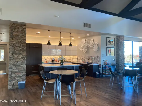 a room with gym equipment and a flat screen tv