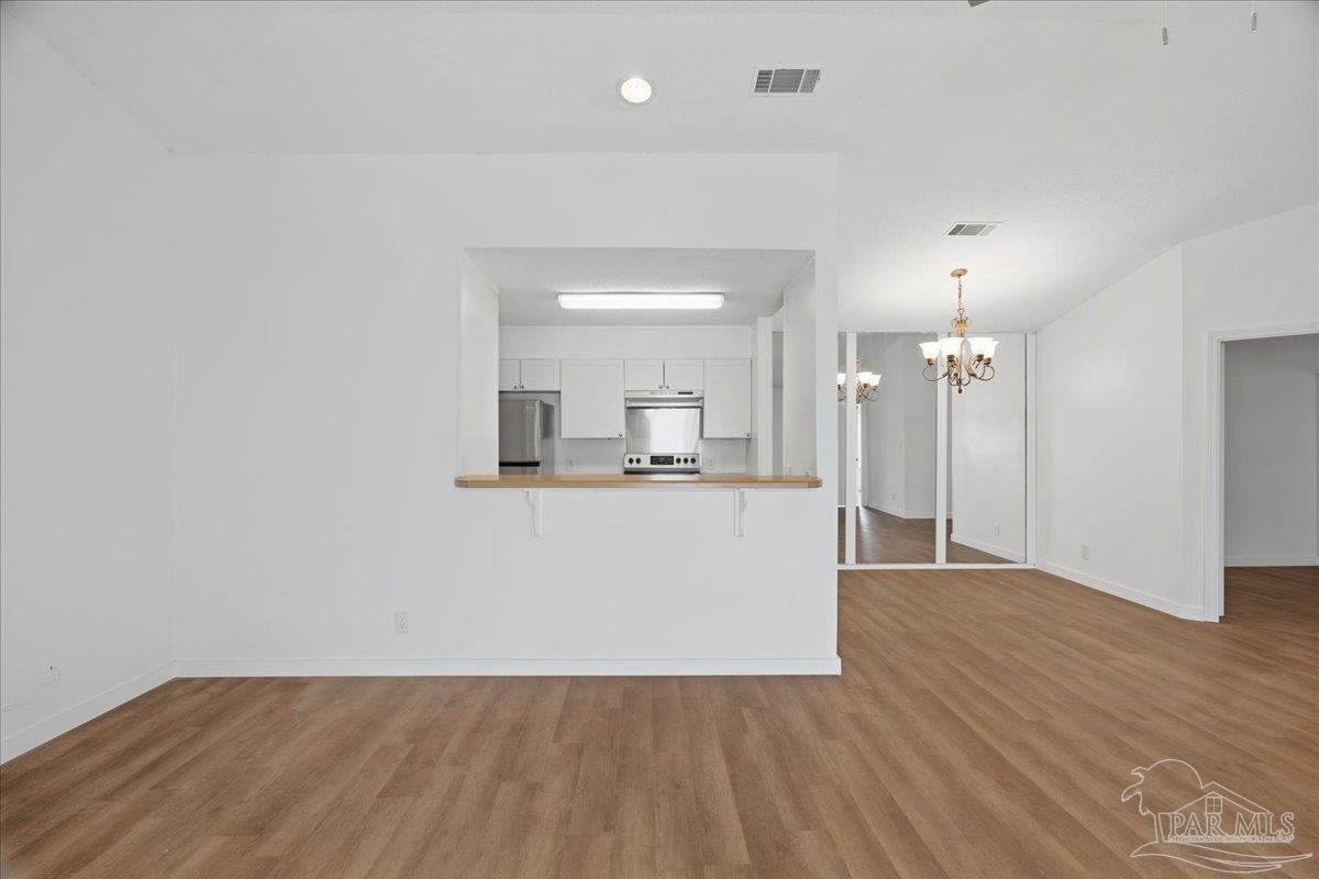 601 East Burgess Road, Unit C6 Pensacola, FL 32504 - Photo 12 of 39 a view of kitchen with wooden floor and window