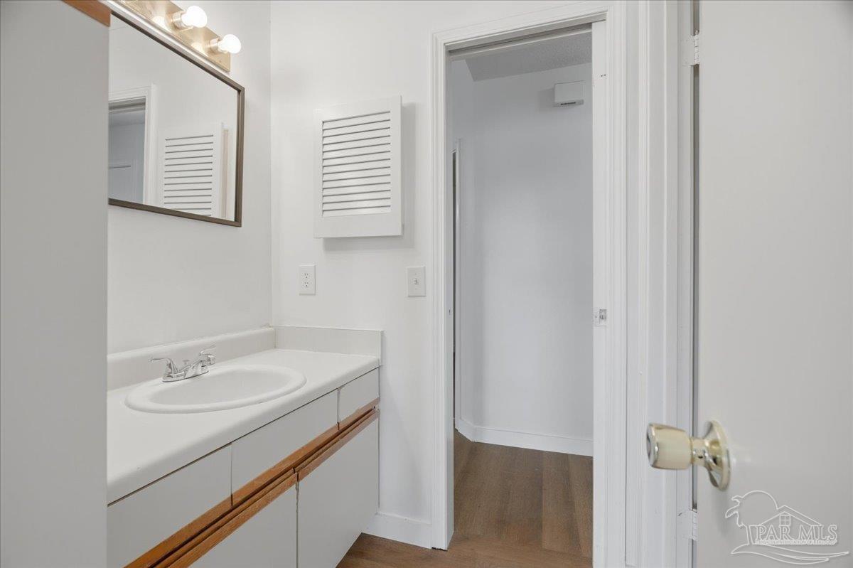 601 East Burgess Road, Unit C6 Pensacola, FL 32504 - Photo 27 of 39 a bathroom with a sink and a mirror