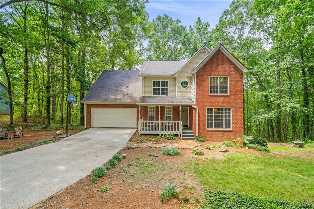 225 Spring Ridge Court Dawsonville, GA 30534 - Photo 1 of 1 front view of a house with a yard