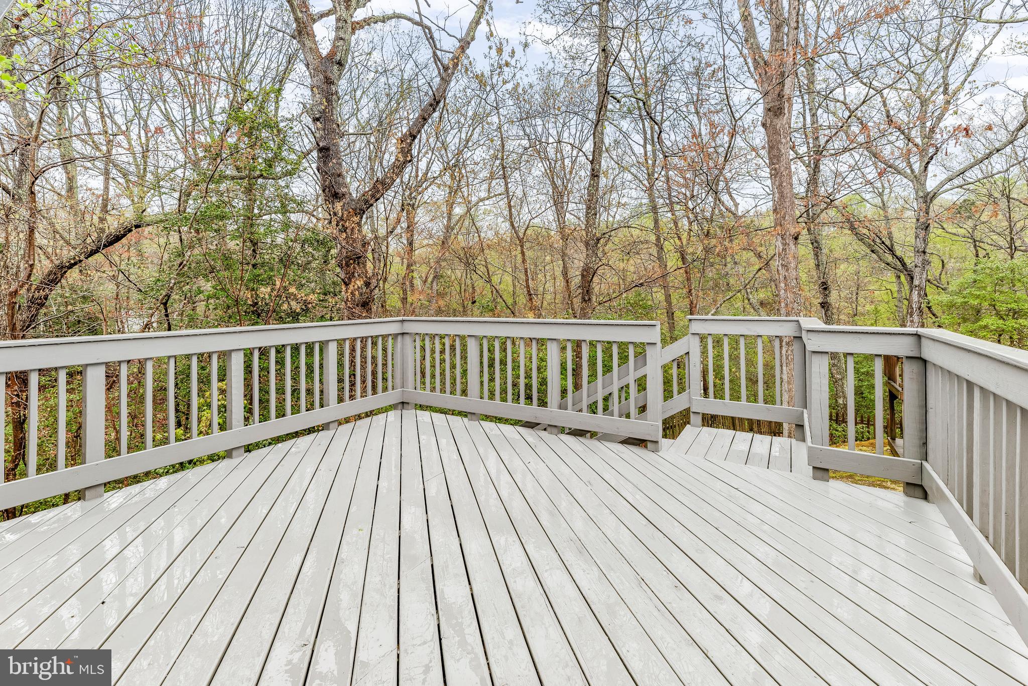 307 Red Cloud Road Lusby, MD 20657 - Photo 15 of 35 a view of deck with wooden floor and fence