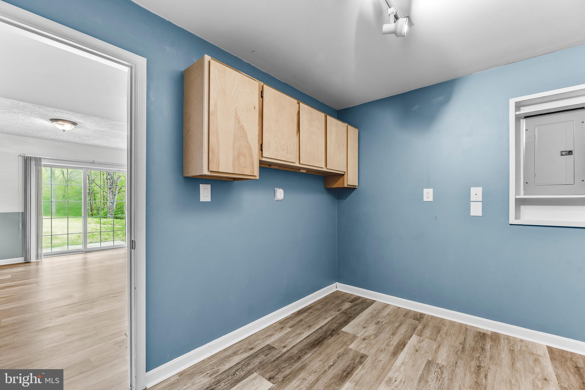 307 Red Cloud Road Lusby, MD 20657 - Photo 30 of 35 a view of a livingroom with wooden floor and a window