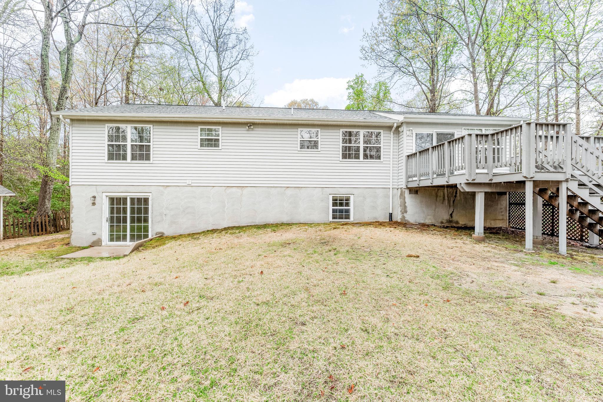 307 Red Cloud Road Lusby, MD 20657 - Photo 35 of 35 a front view of a house with a yard and garage