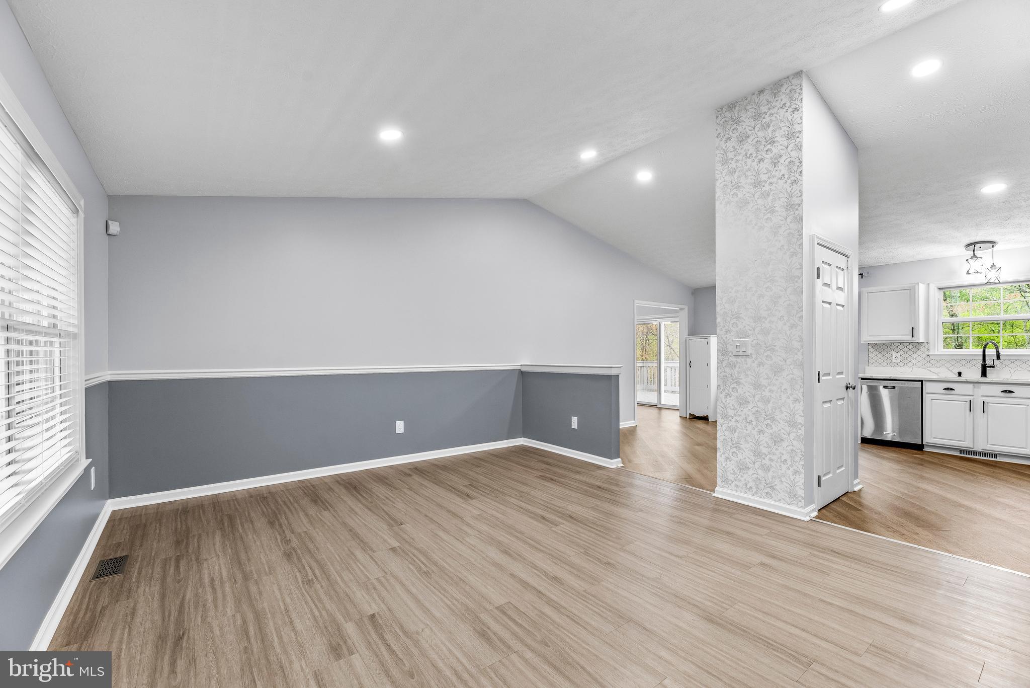 307 Red Cloud Road Lusby, MD 20657 - Photo 4 of 35 a view of a big room with wooden floor and windows