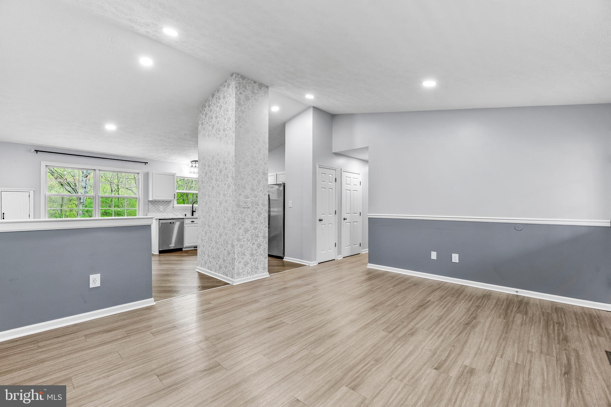 307 Red Cloud Road Lusby, MD 20657 - Photo 5 of 35 a view of a big room with wooden floor and windows