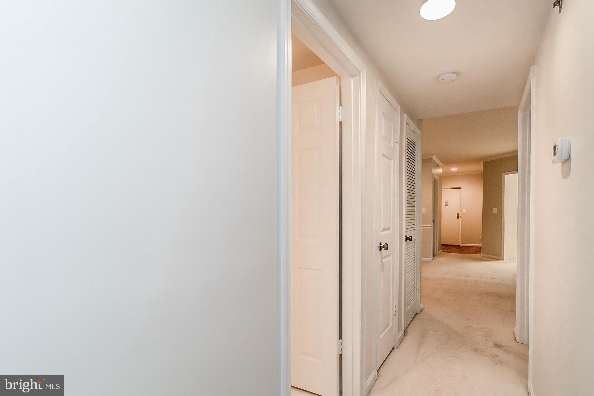 414 Rockfleet Road, Unit 201 Lutherville-Timonium, MD 21093 - Photo 28 of 35 Hallway from primary bedroom