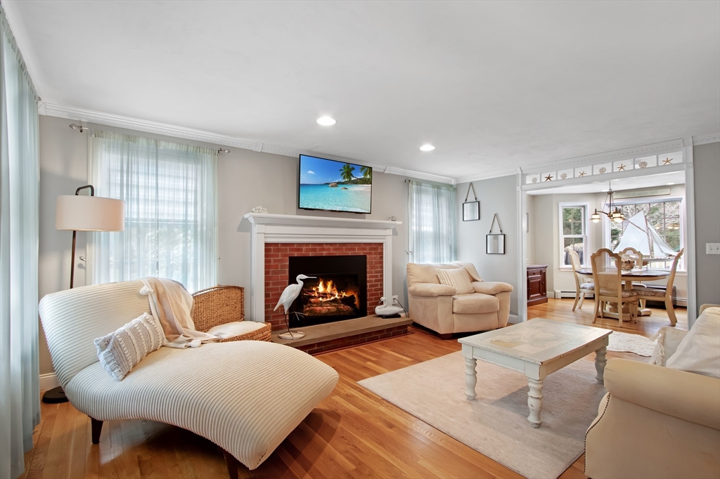 842 Main Street Wareham, MA 02571 - Photo 7 of 42 a living room with furniture and a fireplace
