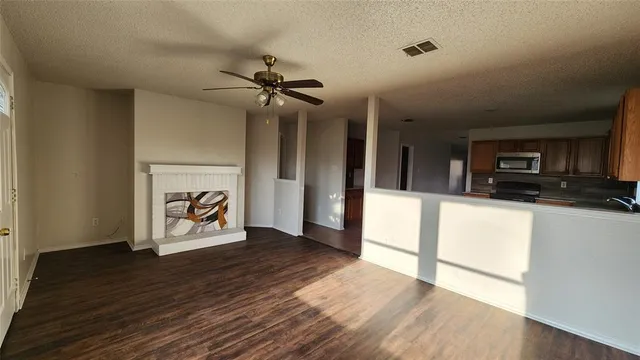 a view of a livingroom with wooden floor