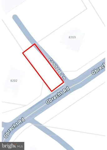 an aerial view of a house a yard and swimming pool