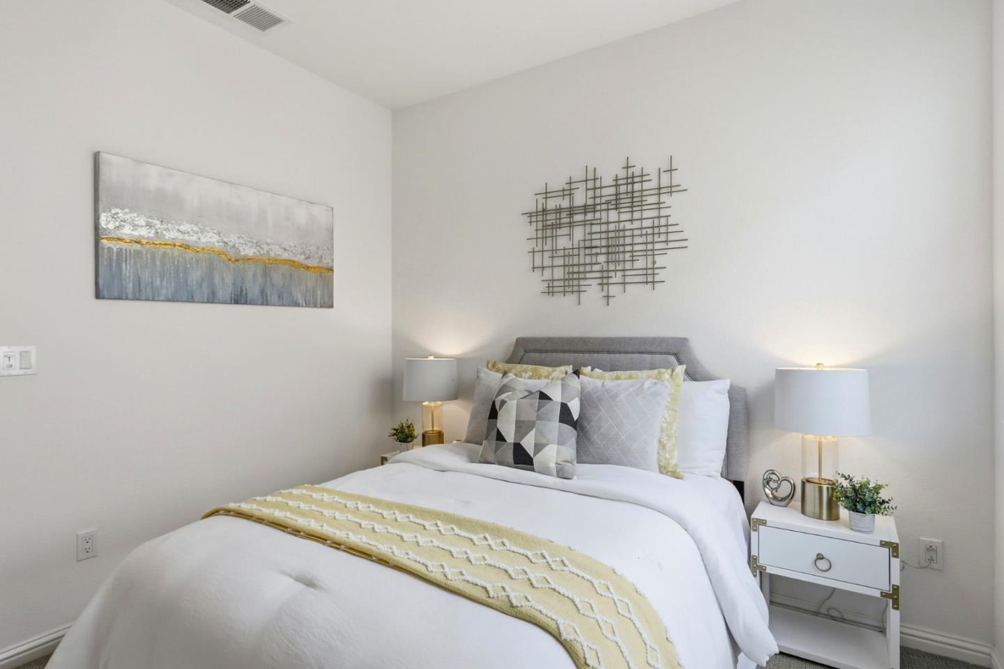 2580 Gimelli Way San Jose, CA 95133 - Photo 16 of 40 a bedroom with a bed and a night stand