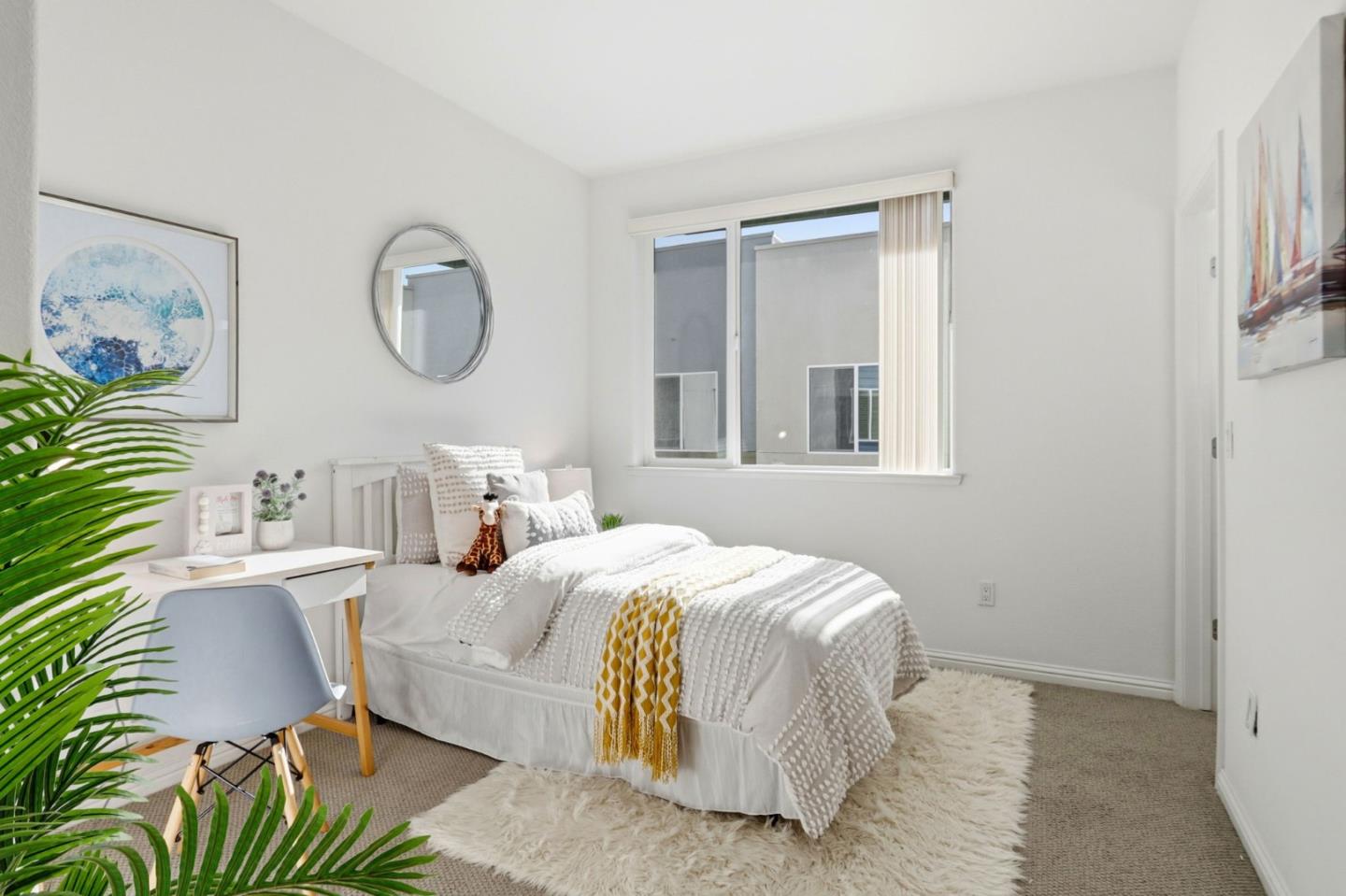 2580 Gimelli Way San Jose, CA 95133 - Photo 18 of 40 a bedroom with a bed lamps and a mirror