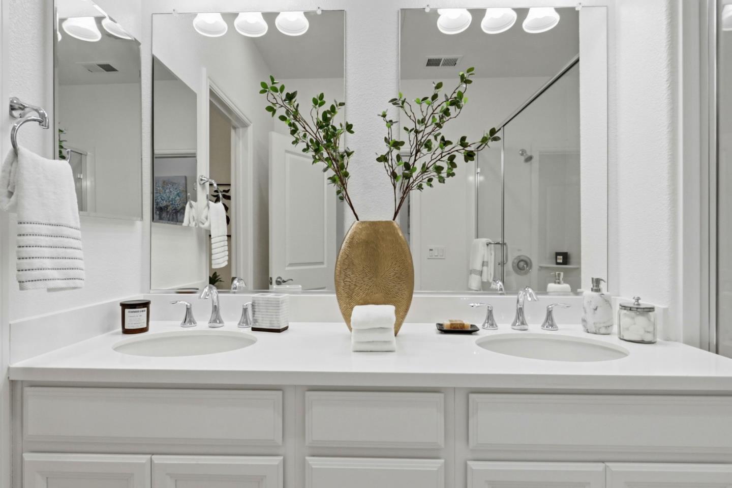 2580 Gimelli Way San Jose, CA 95133 - Photo 31 of 40 a bathroom with double vanity sinks a vanity and a mirror