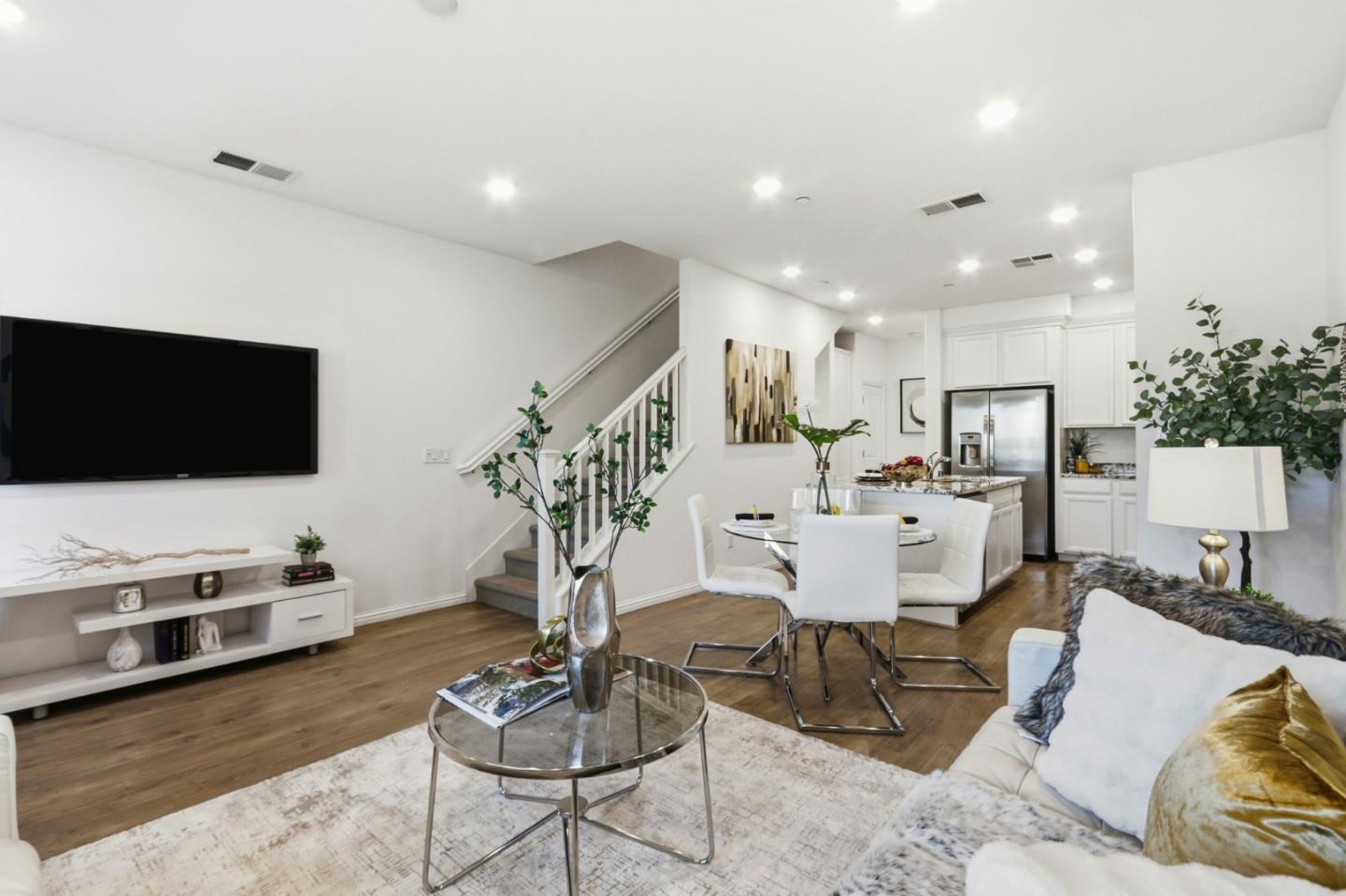 2580 Gimelli Way San Jose, CA 95133 - Photo 5 of 40 a living room with furniture and a flat screen tv
