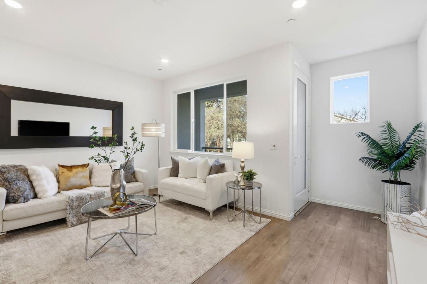 2580 Gimelli Way San Jose, CA 95133 - Photo 6 of 40 a living room with furniture and a potted plant