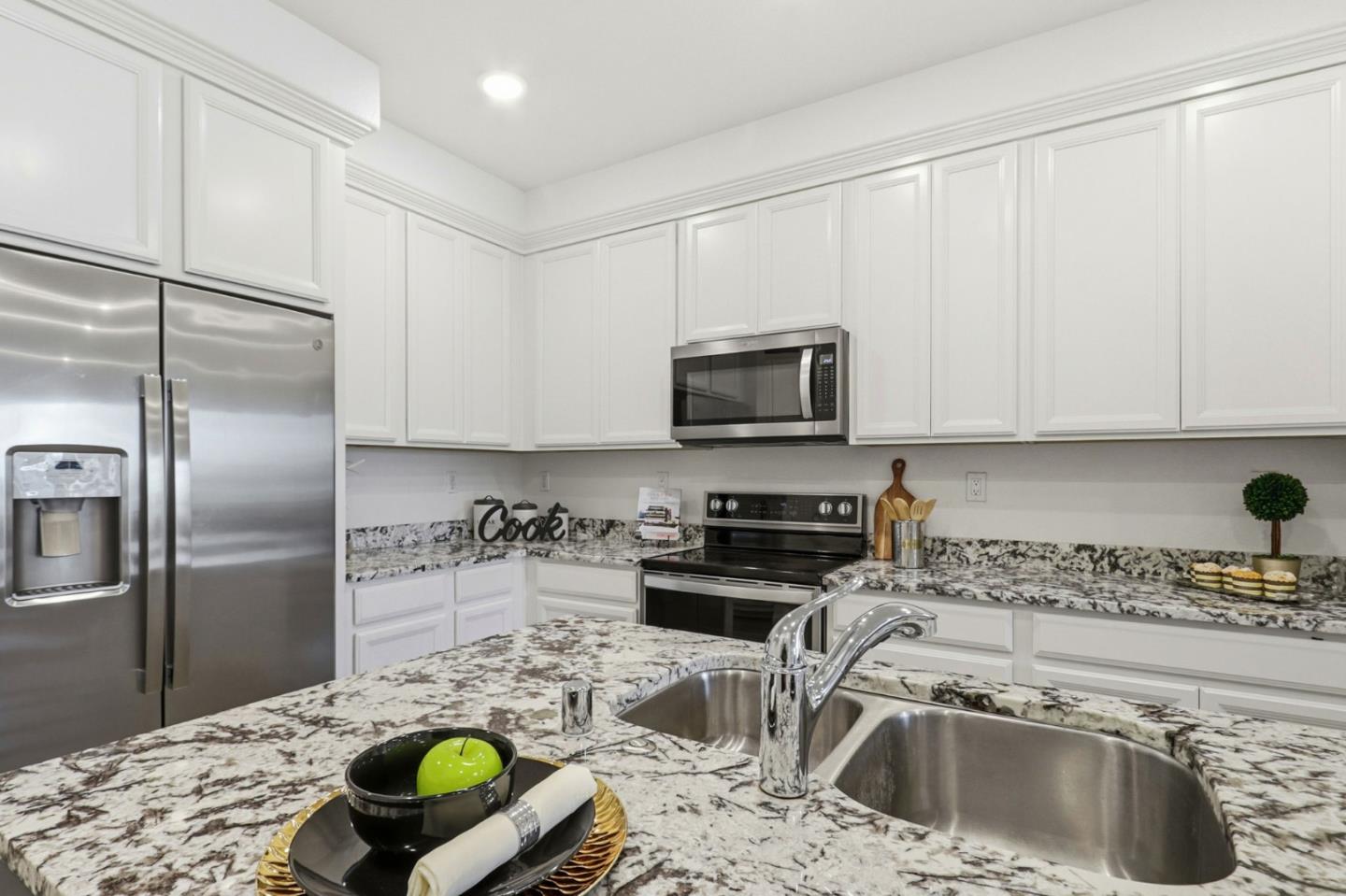 2580 Gimelli Way San Jose, CA 95133 - Photo 8 of 40 a kitchen with a sink a stove and refrigerator