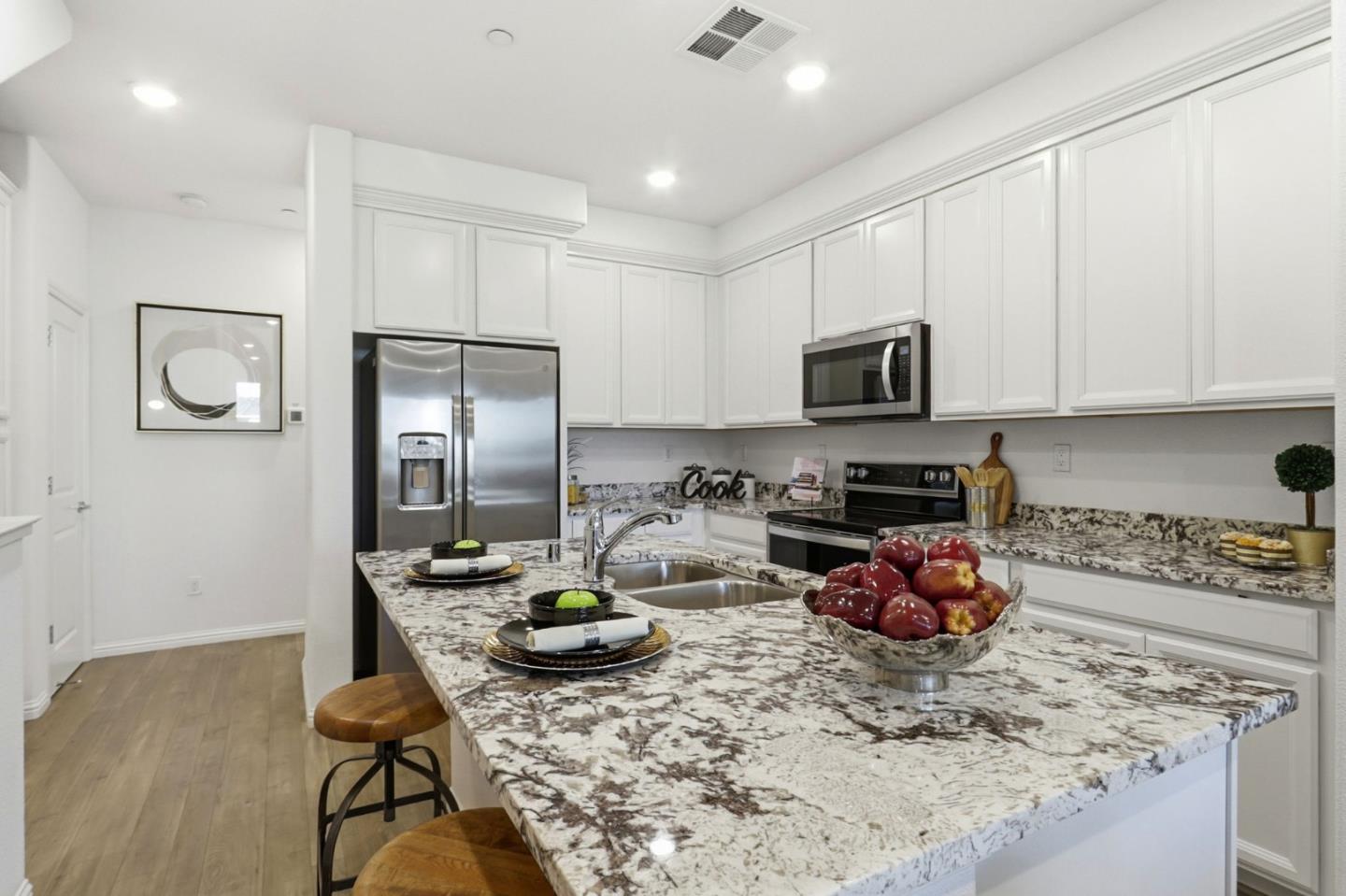 2580 Gimelli Way San Jose, CA 95133 - Photo 9 of 40 a kitchen with sink a refrigerator and cabinets