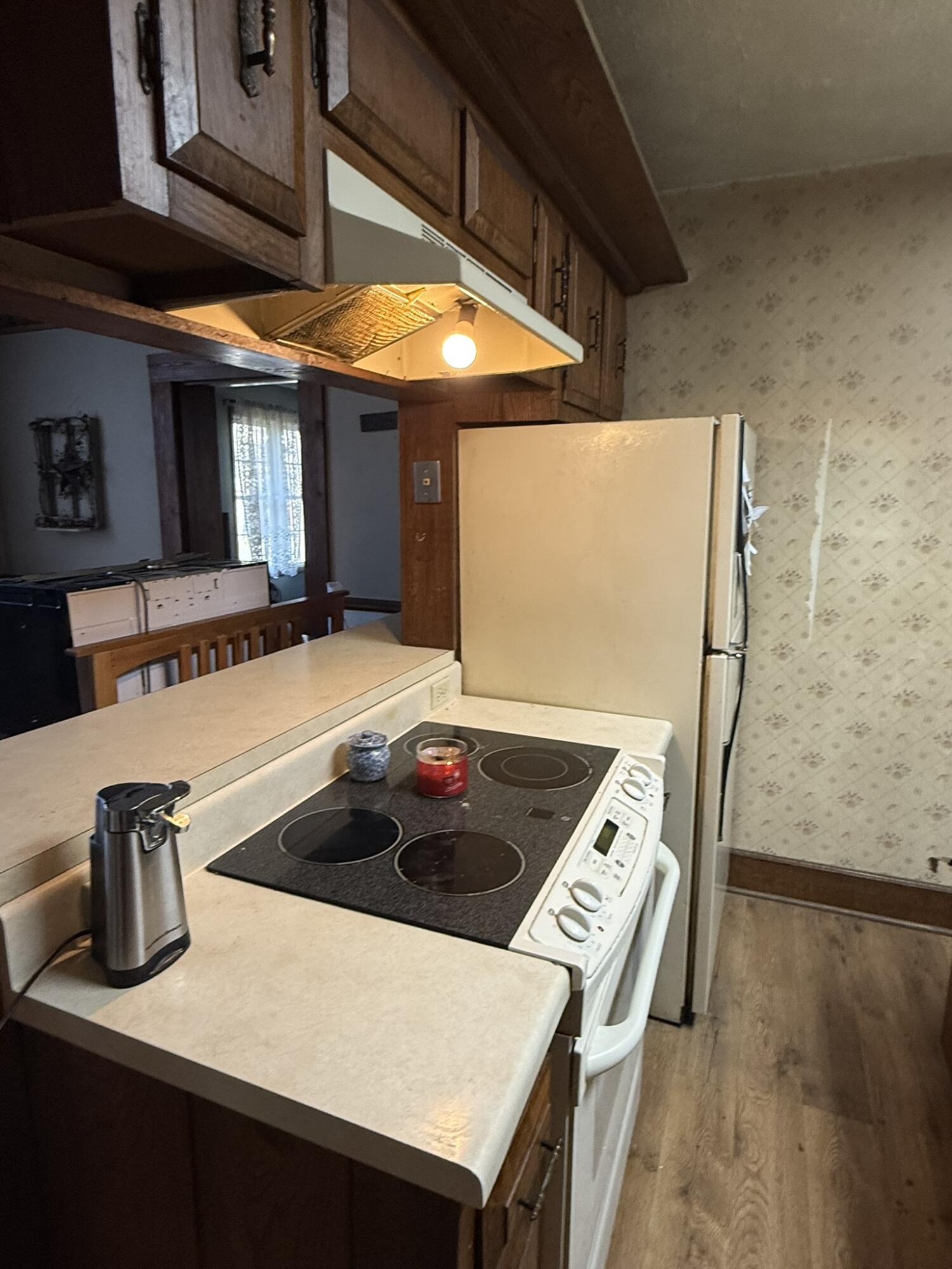 1708 Midland Trail Covington, VA 24426 - Photo 14 of 21 a kitchen with stainless steel appliances granite countertop a sink a stove and white cabinets
