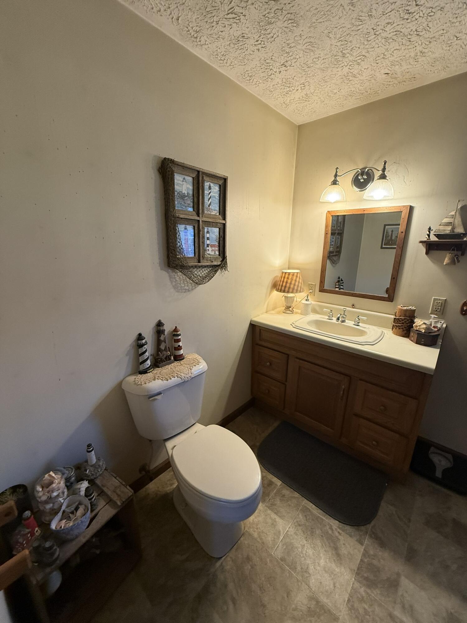 1708 Midland Trail Covington, VA 24426 - Photo 19 of 21 a bathroom with a sink toilet and a mirror
